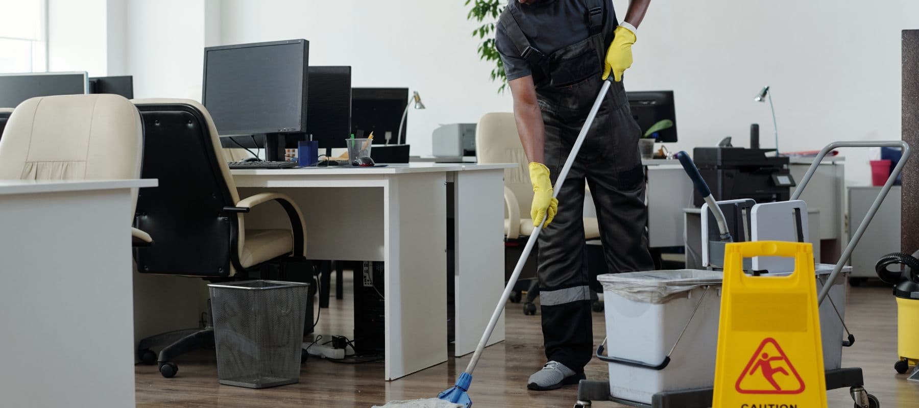 Cleaning company mopping floor with supplies